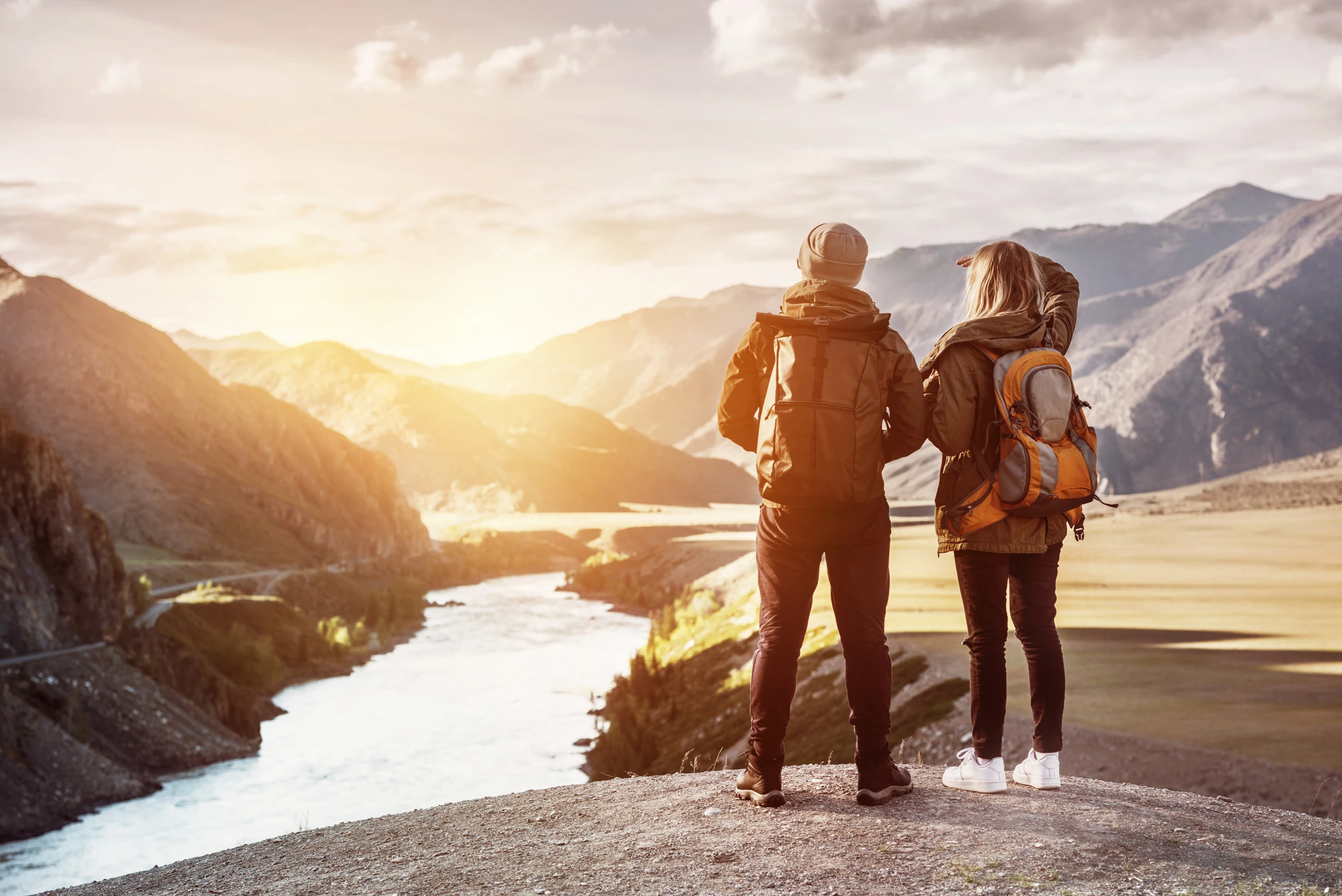 Travellers looking out over a scenic valley